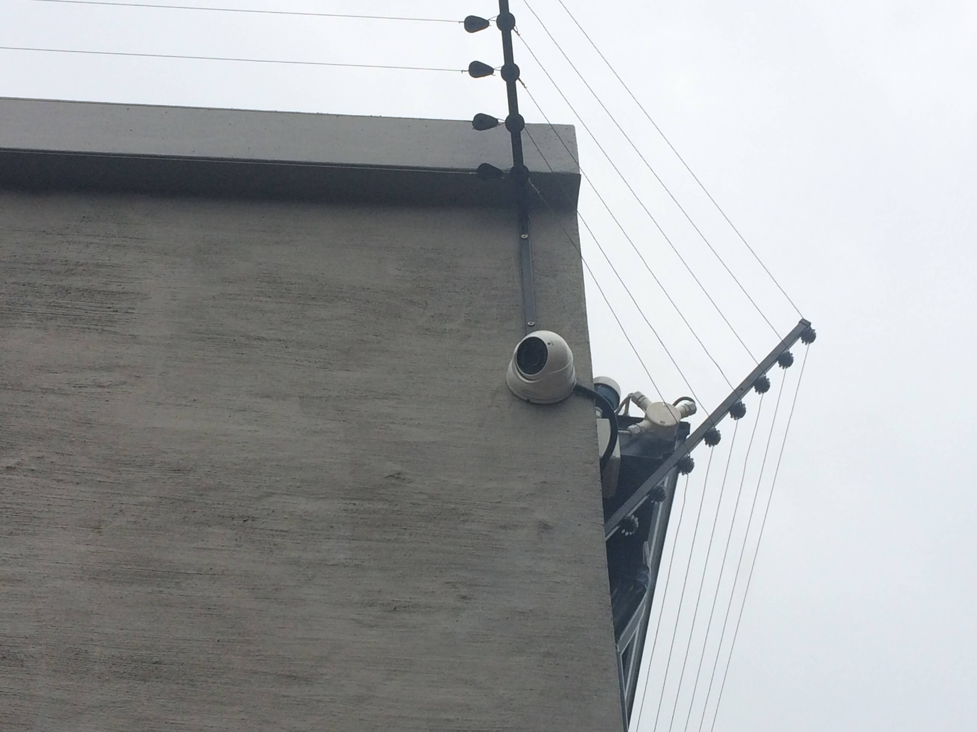 Outdoor security camera mounted for coverage